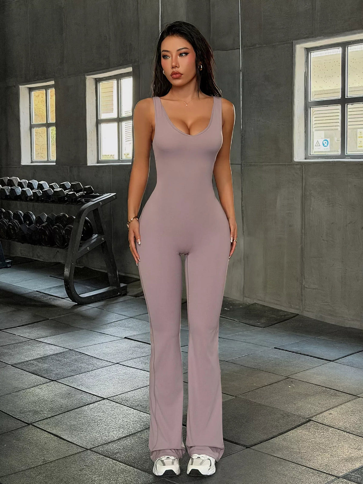 sleeveless active jumpsuit with flared leg design | dropsona - neutral - front view
