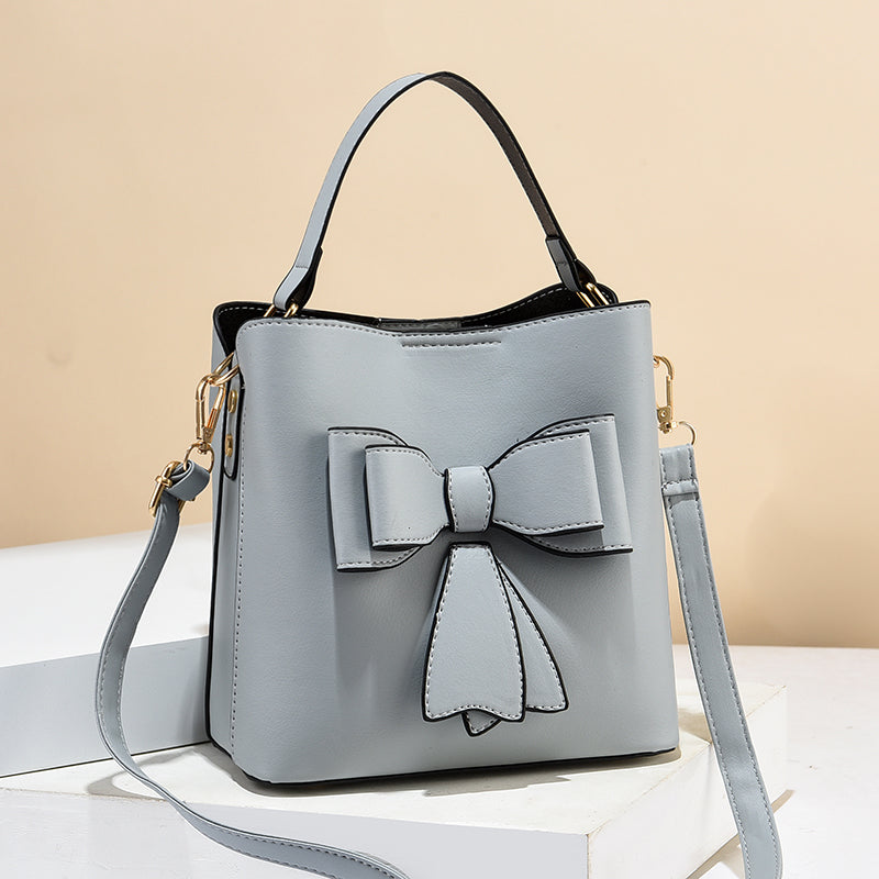 classic bucket bow women's crossbody bag - large capac | dropsona - neutral - material texture
