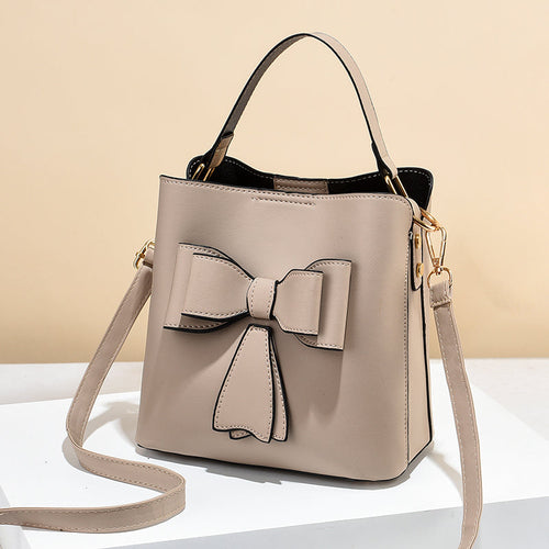 classic bucket bow women's crossbody bag - large capac | dropsona - neutral - close-up detail