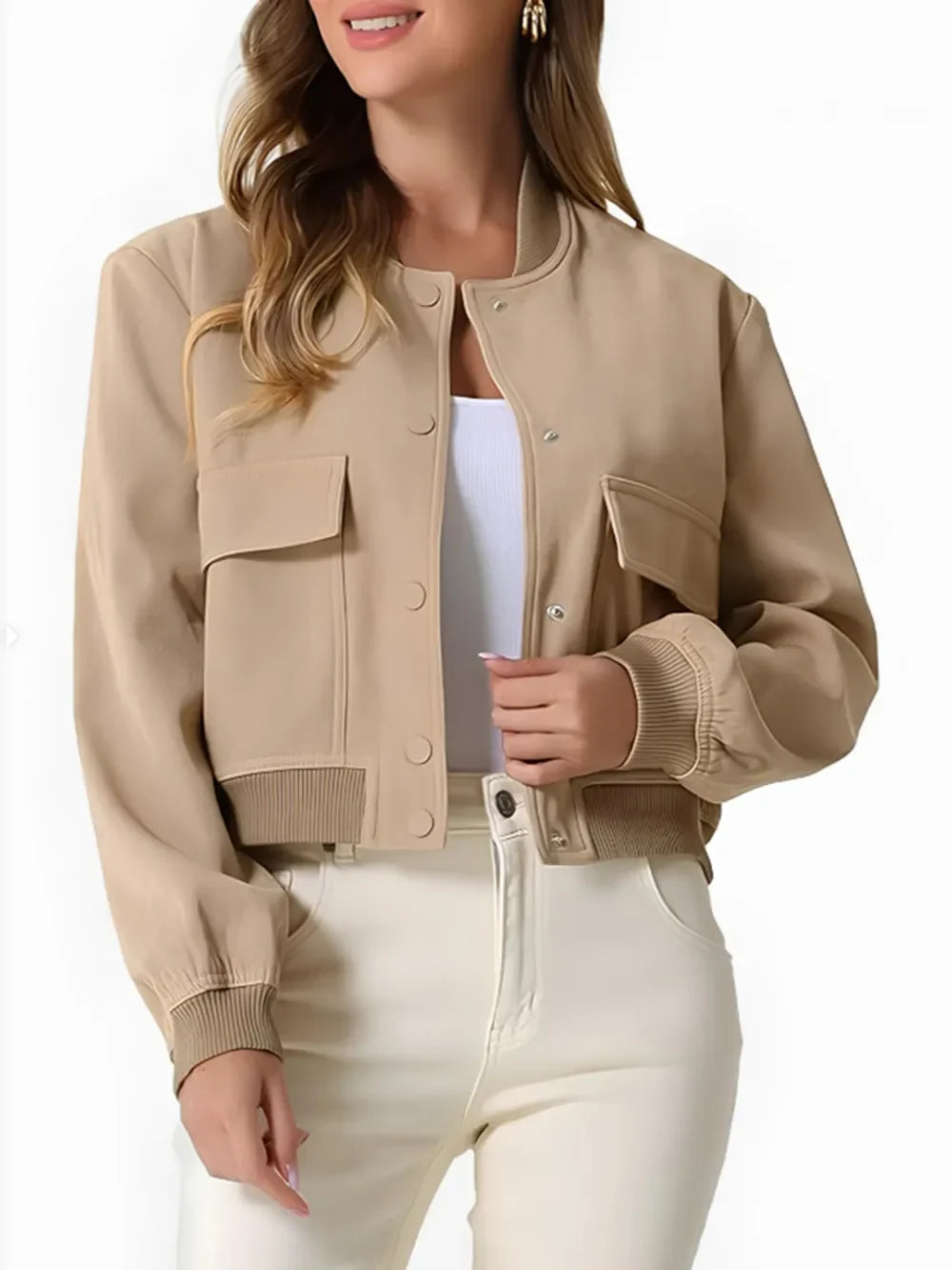 A woman wearing a cropped beige bomber jacket, an urban everyday essential