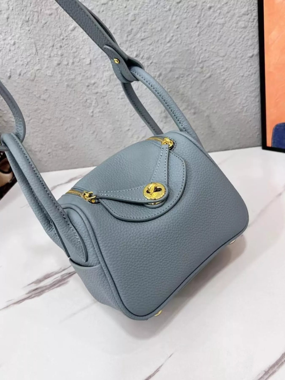 gold-tone hardware leather crossbody bag | dropsona - neutral - close-up detail