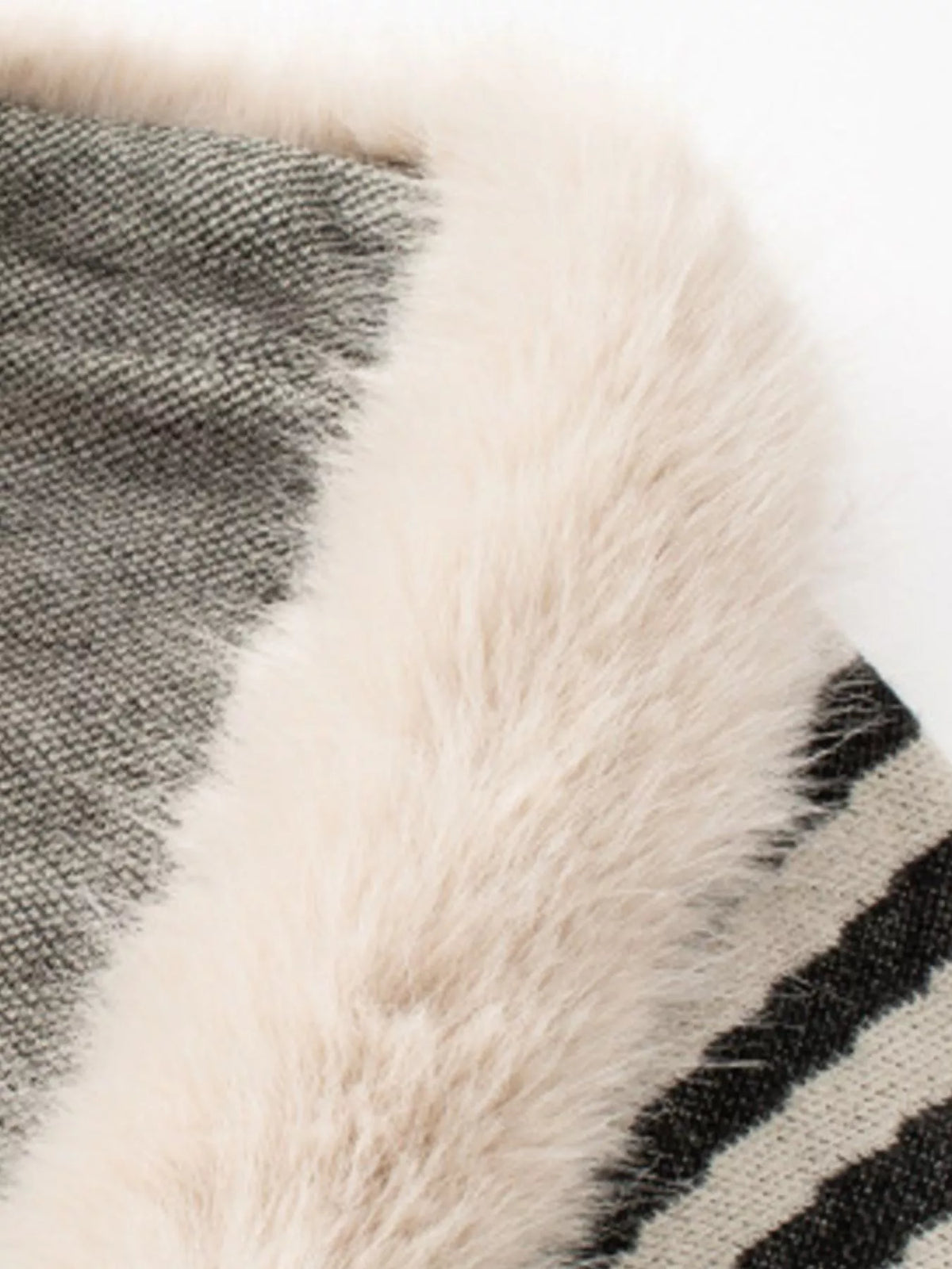 faux fur trimmed striped knit fringe poncho – | dropsona - neutral - close-up detail