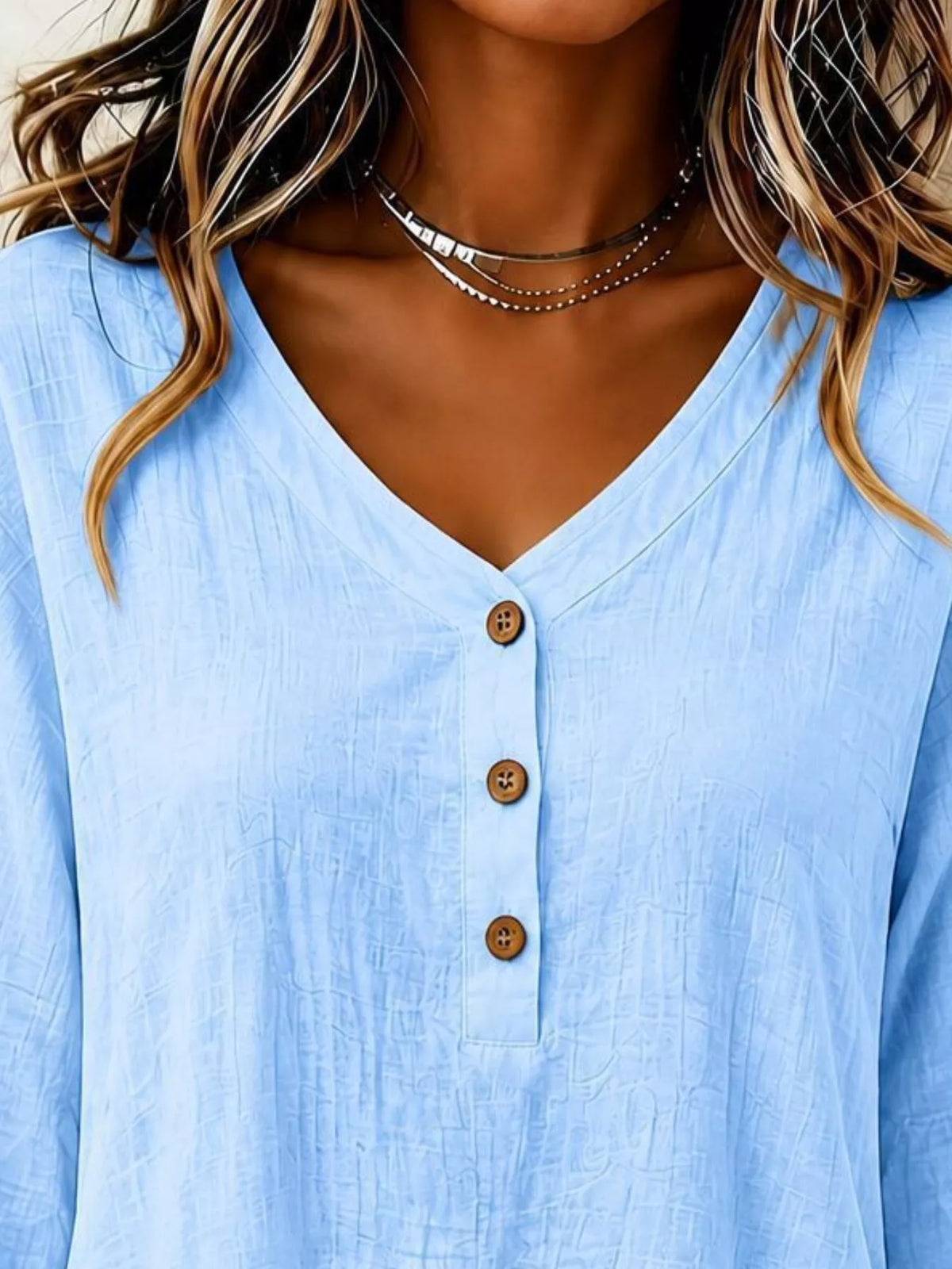 v-neck long sleeve button detail ruffled hem blouse | dropsona - neutral - front view