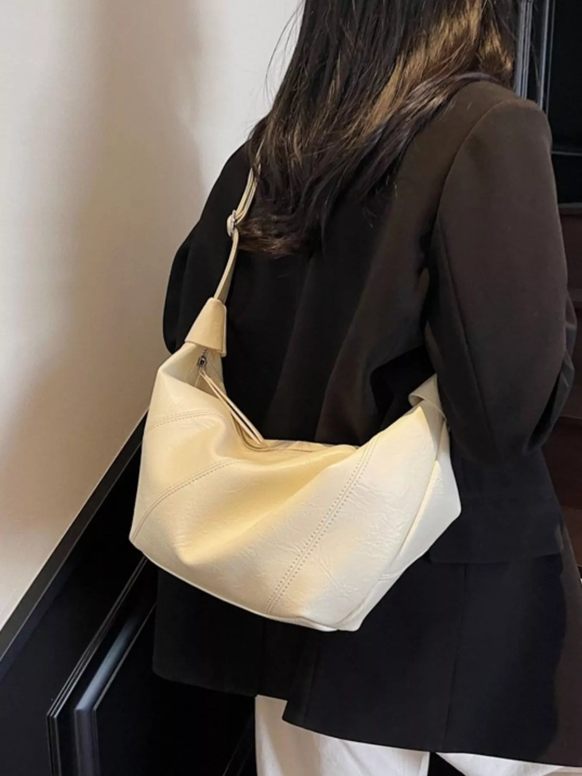 slouchy crossbody bag with adjustable strap | dropsona - neutral - close-up detail