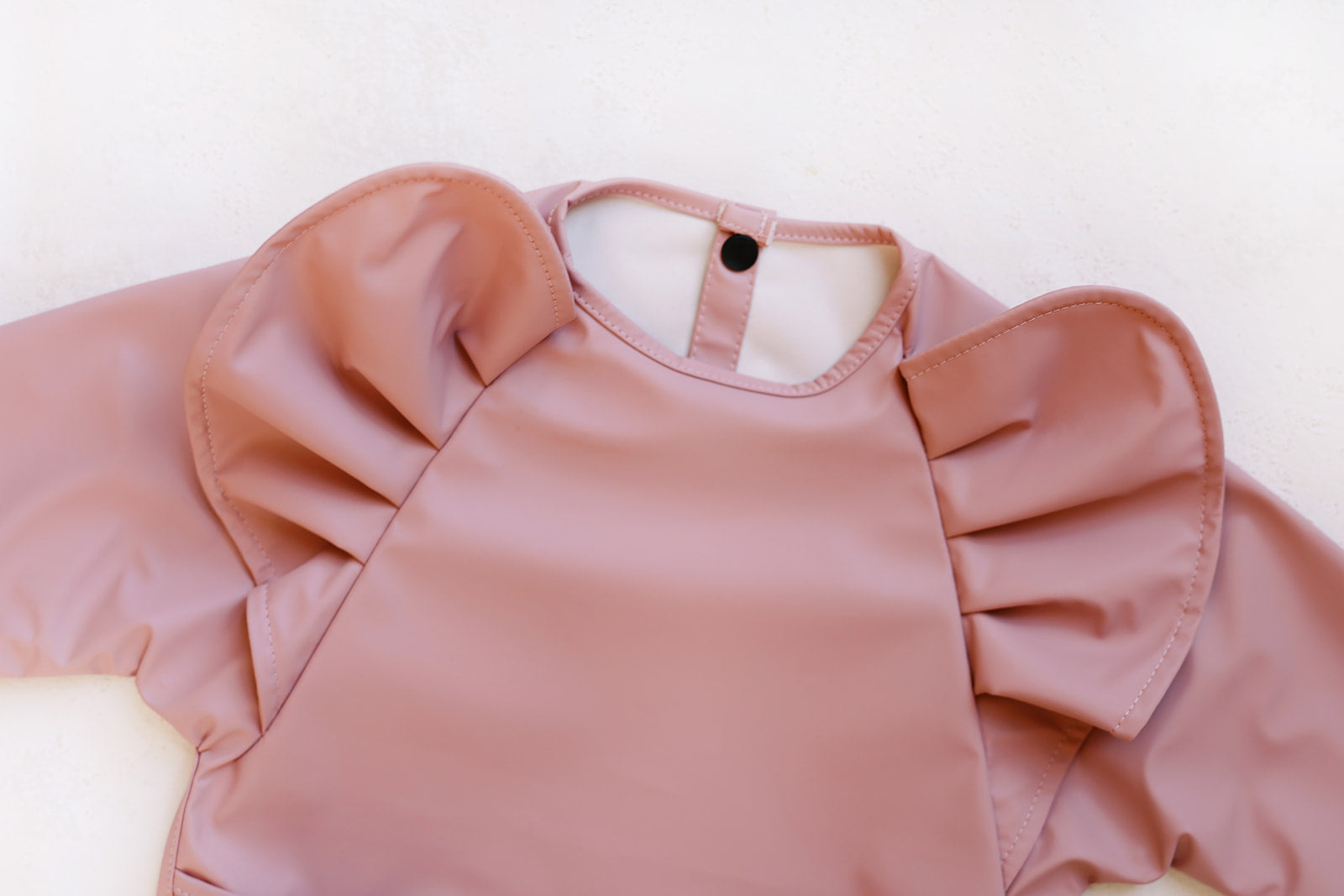 peony long sleeve ruffle angel bib – certified baby sa | dropsona - neutral - front view