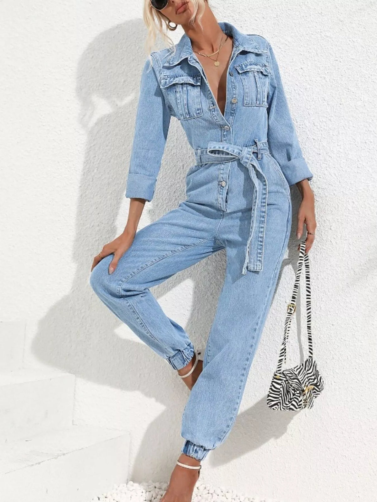 long sleeve button-up denim jumpsuit with belted | dropsona - neutral - close-up detail