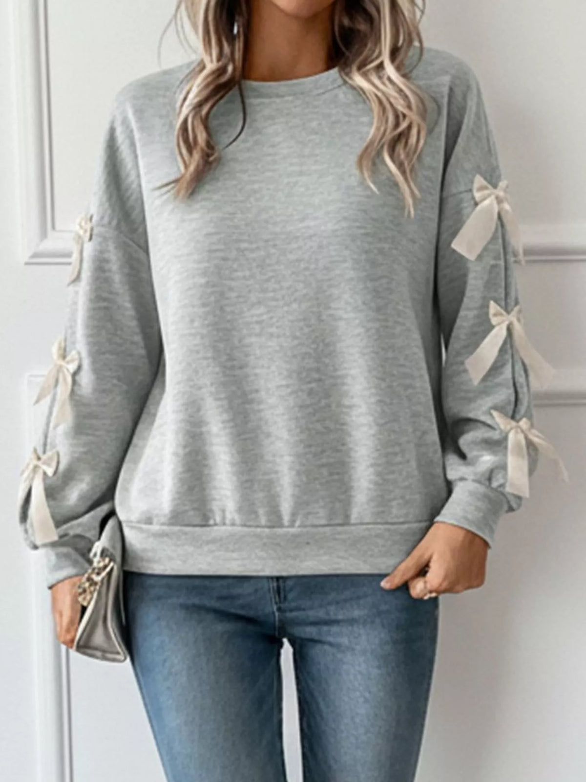 crew neck sweatshirt with decorative bow | dropsona - neutral - front view