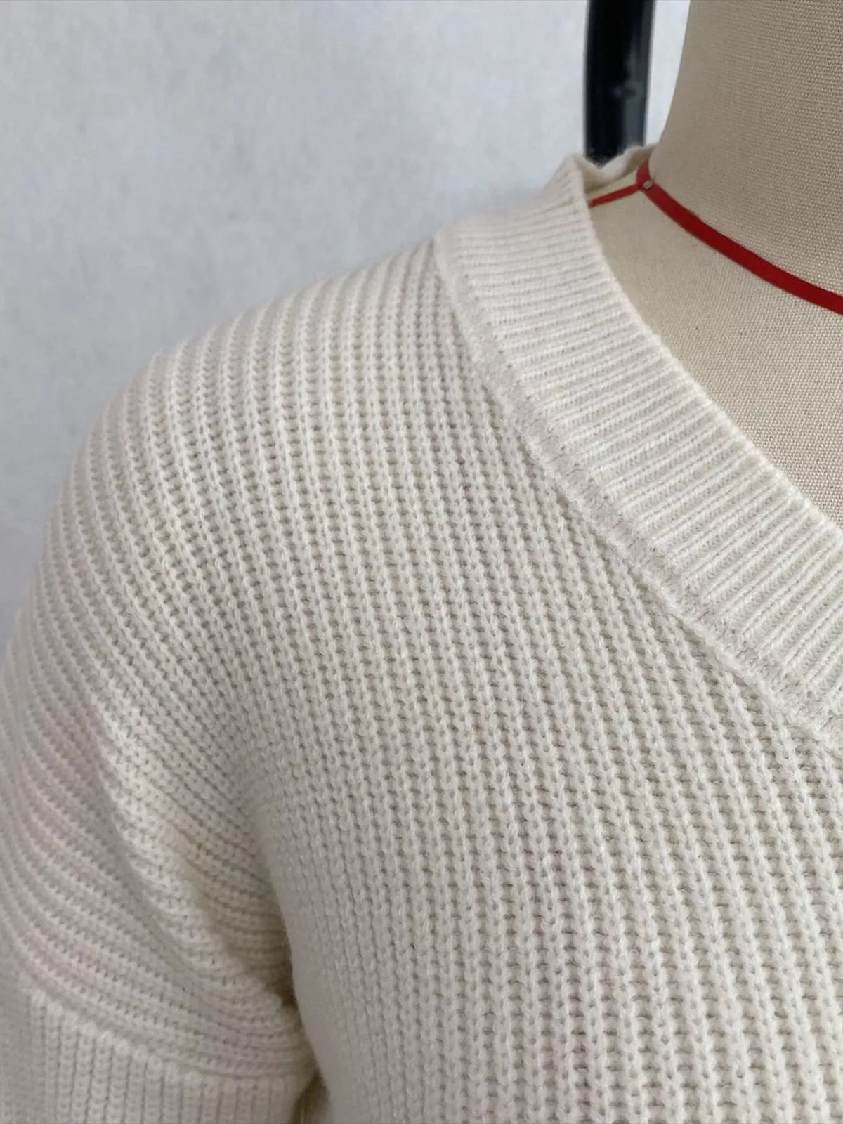v-neck peplum hem ribbed knit top – | dropsona - neutral - front view