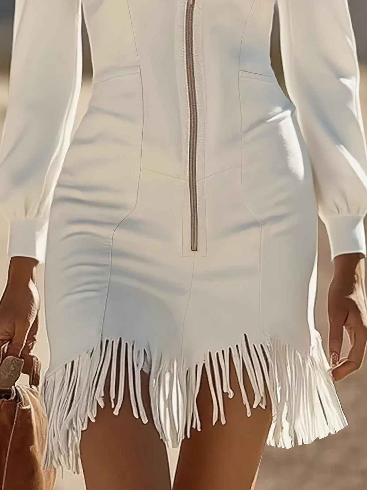 zip-front long sleeve fringe hem mini dress | dropsona - neutral - close-up detail