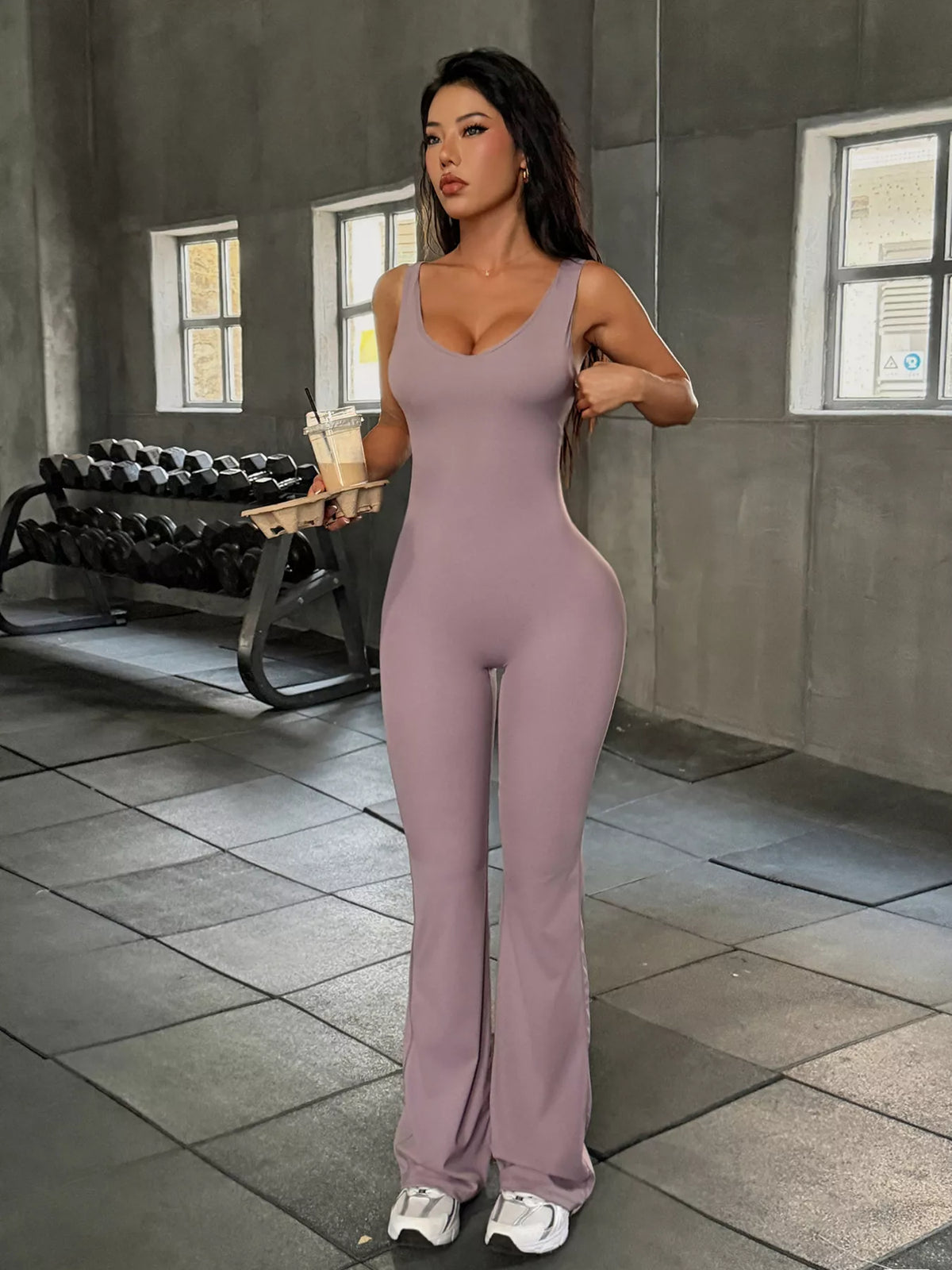 sleeveless active jumpsuit with flared leg design | dropsona - neutral - close-up detail