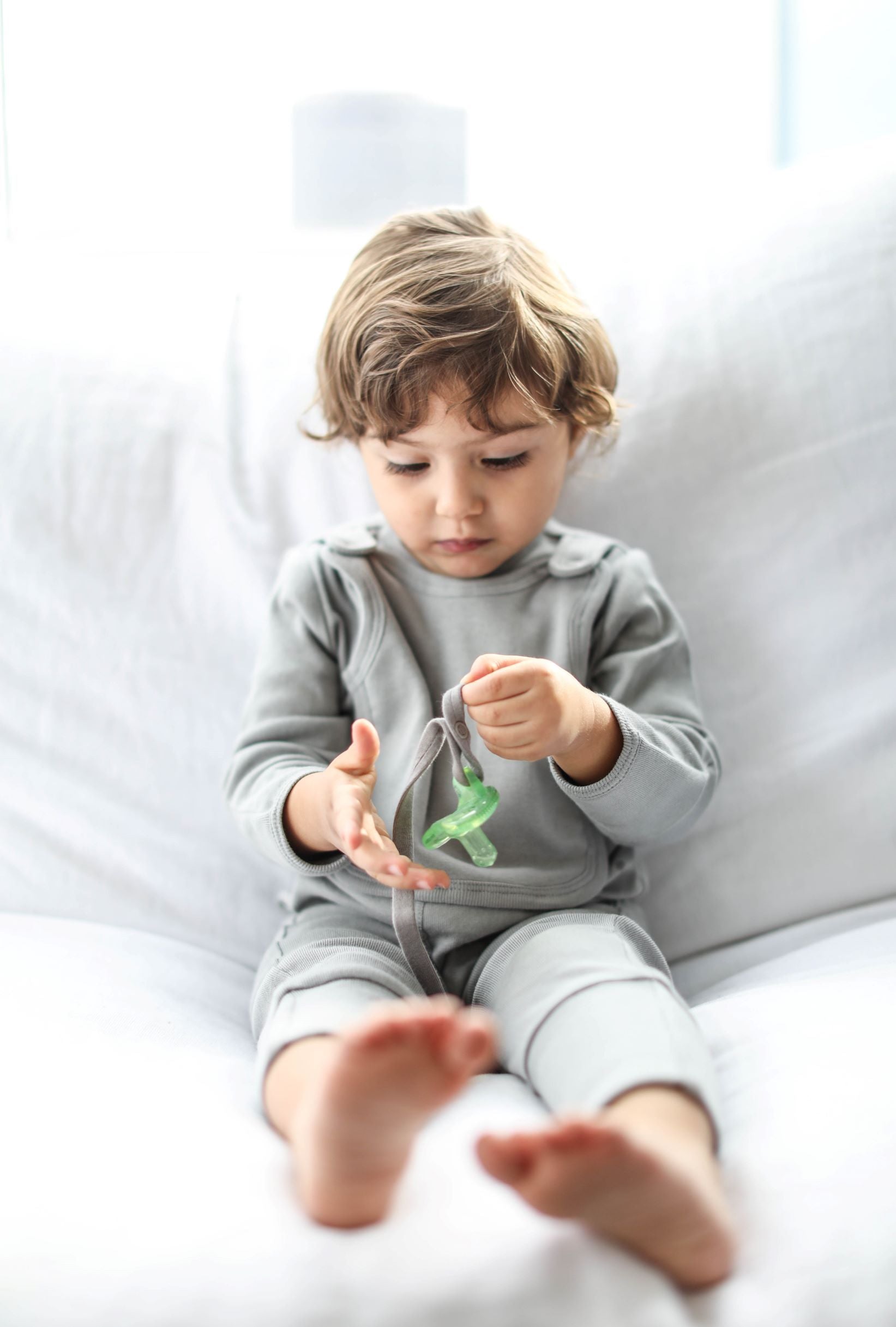 smart footed one-piece + bib - gray – a pj with an att | dropsona - neutral - front view