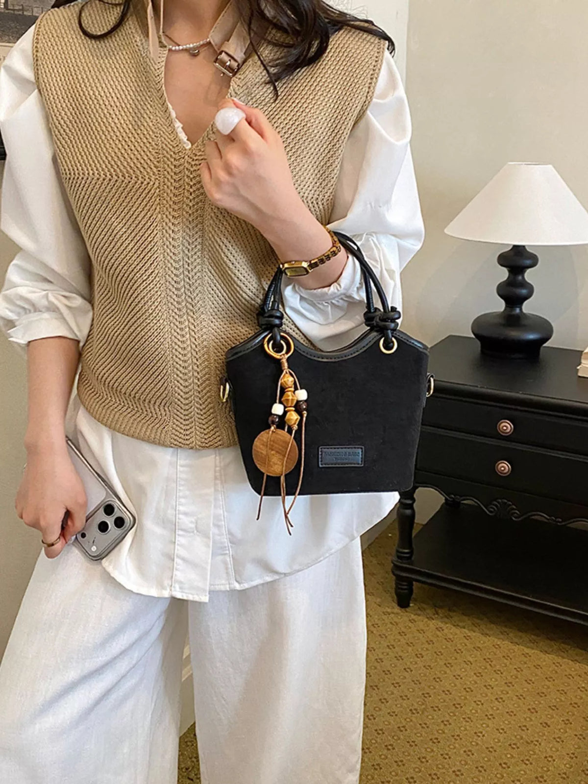 suede crossbody bag with decorative wooden bead charm | dropsona - neutral - material texture