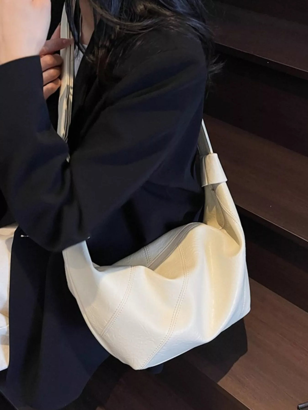 slouchy crossbody bag with adjustable strap | dropsona - neutral - material texture