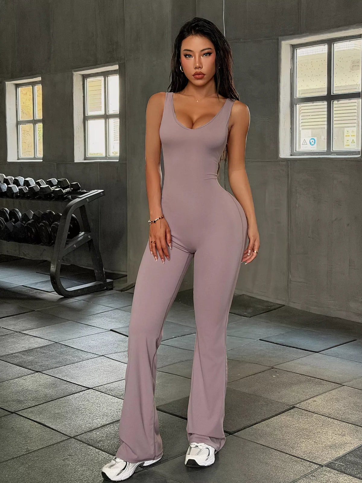 sleeveless active jumpsuit with flared leg design | dropsona - neutral - material texture