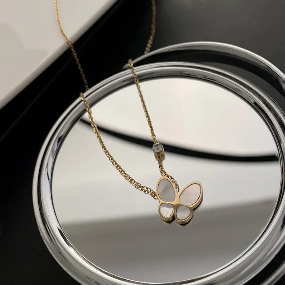 womens necklace with butterfly pedant – this ne | dropsona - neutral - material texture