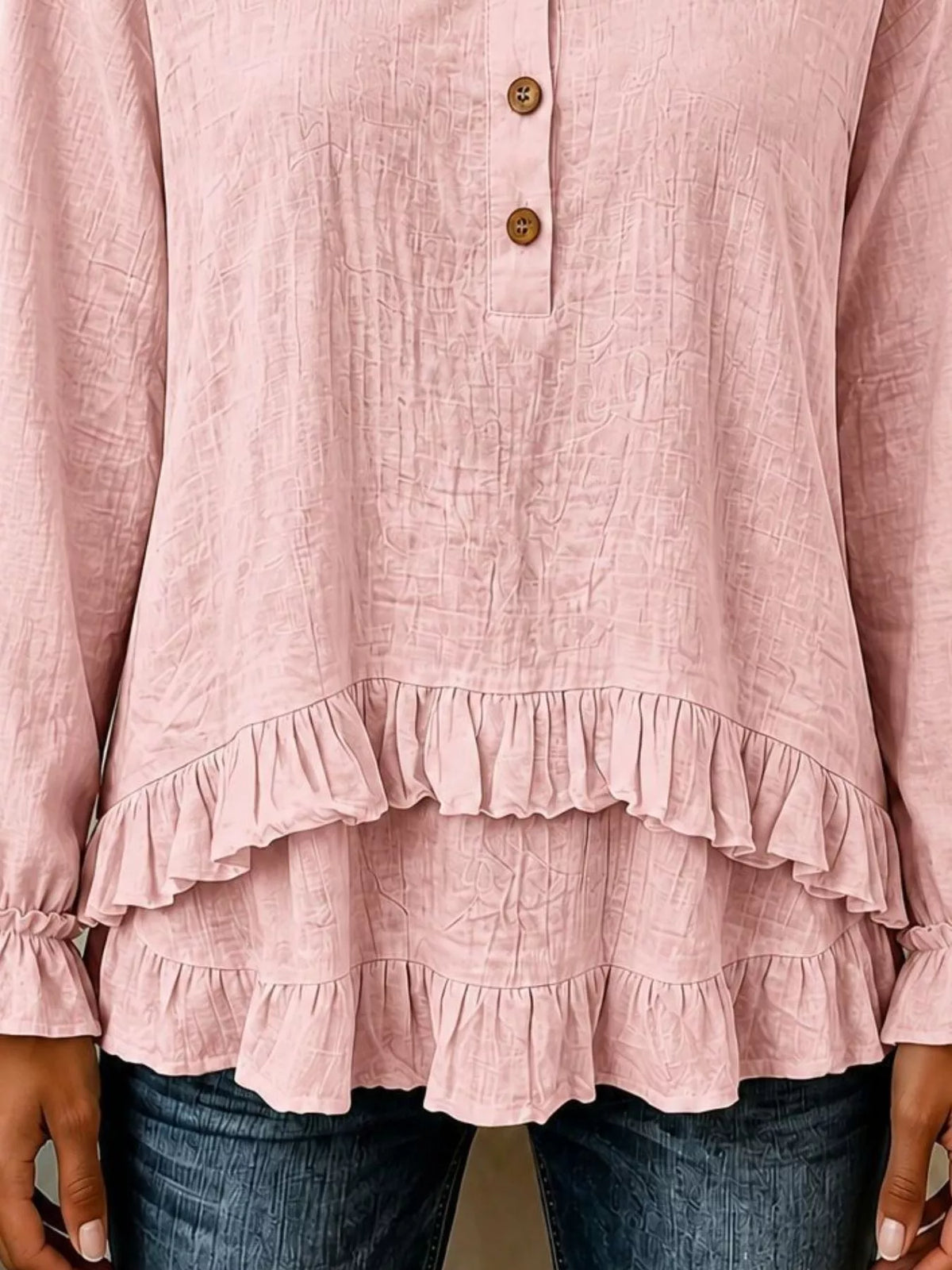 v-neck long sleeve button detail ruffled hem blouse | dropsona - neutral - close-up detail