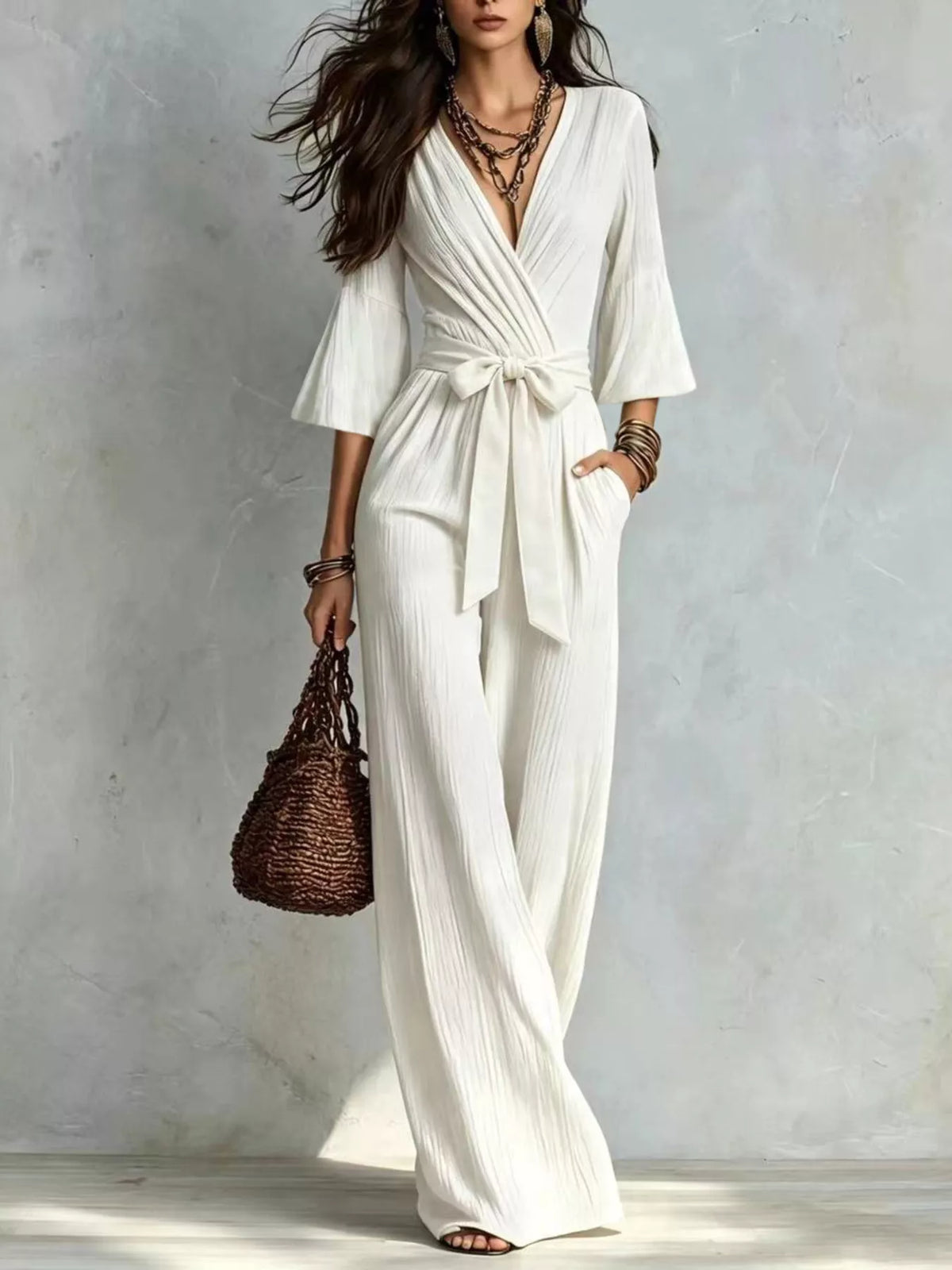 pleated wide-leg jumpsuit with tie-waist | dropsona - neutral - close-up detail